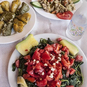 Greek Cuisine. Horta or Wild Greens, Courgettes with Rice, Stuffed Cabbage Leaves Dolma