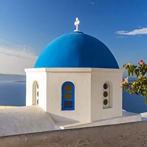 Greek orthodox church with blue dome, Oia, Santorini, South Aegean, Greece