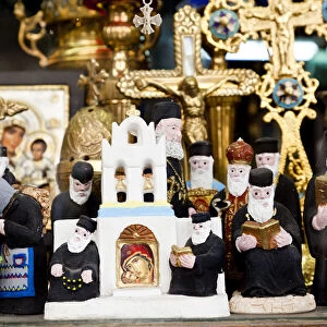 Greek Orthodox priest models & other orthodox icons in shop front, Athens, Greece