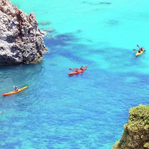 Group of people kayaking, Tsigrado, Milos Island, Cyclades Islands, Greece