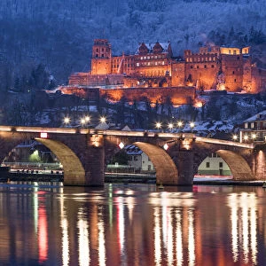 Heidelberg castle and Old Bridge illuminated in winter at night, Baden-Wurttemberg