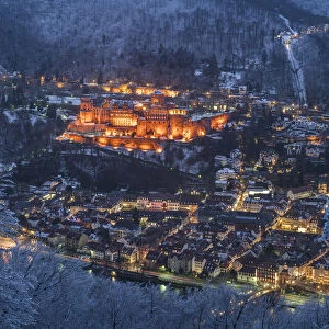Heidelberg castle and old town in winter seen from Heiligenberg mountain