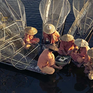 High angle view of traditional fishermen on Lake Inle having a supper on boats together