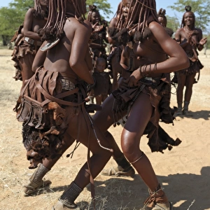 Himba women perform the otjiunda dance