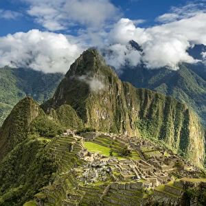 Historic ancient archeological Incan Machu Picchu on mountain in Andes, Cuzco Region