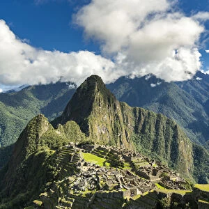 Historic ancient Incan Machu Picchu on mountain in Andes, Cuzco Region, Peru