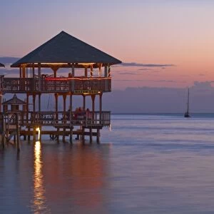 Honduras, Bay Islands, Roatan, West End, Fosters bar and restaurant at sunset