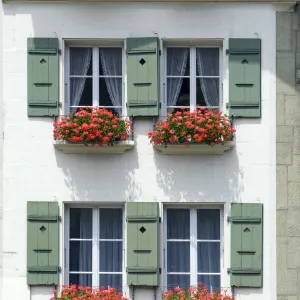 Front of a house with flowerboxes in Bern, Switzerland