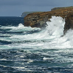 Huge waves crash against the layered cliffs of Yesnaby on the wild west coast of Mainland