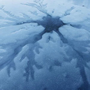 Ice patterns on a frozen lake surface, Emilia Romagna, Italy