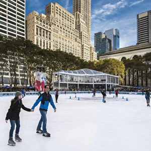Ice skating in Bryant Park, Manhattan, New York, USA