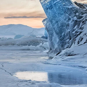 Iceberg frozen in the sea ice off Spitsbergen East Coast, Svalbard