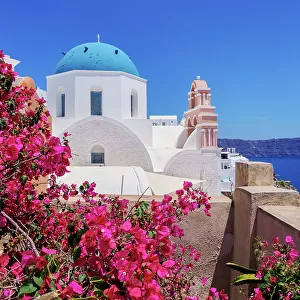 Iconic blue domed church of Resurrection of the Lord, Oia Village, Santorini or Thira Island, Cyclades, Greece