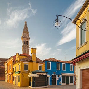 The iconic leaning bell-tower of Burano at dawn, Venice, Veneto, Italy