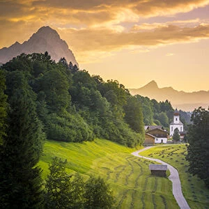 The iconic Wamberg Church, with Mount Alpspitze and Zugspitze on the background. Wamberg