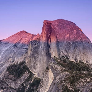 Idyllic view of Half Dome granite rock formation at Yosemite National Park during sunset