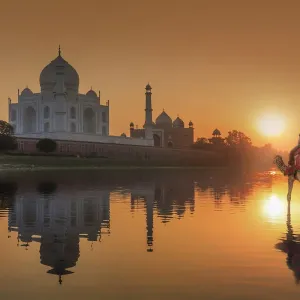 Print of Woman Crossing Yamuna River with Reflected Taj Mahal