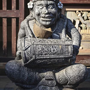 Indonesia, Bali, Tenganan Dau village. A stone statue of a spirit