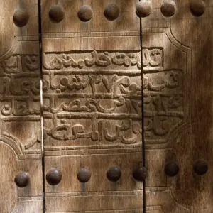 An inscription on the wooden door of the