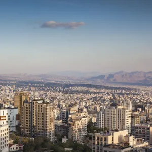 Iran, Tehran, elevated city skyline from the Roof of Iran park, sunset