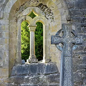 Ireland, Co. Mayo, Cong, Cong Abbey, Celtic cross and arched window