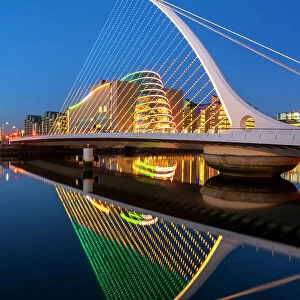 Ireland, Dublin, River Liffey, Samuel Beckett Bridge and convention centre at dusk