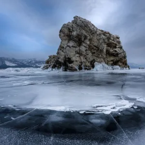 An island surrounded with flat ice over lake Baikal, Irkutsk region, Siberia, Russia