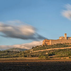 Italy, Umbria, Assisi, Basilica of Saint Francis at sunset
