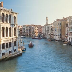 Italy, Veneto, Venice, view on the Grand Canal at sunrise with boats passing through