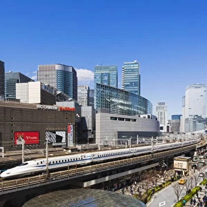 Japan, Honshu, Tokyo, Yurakucho, Skyline and Shinkansen Bullet Train