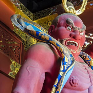 Japanese wooden guardian at the entrance of Taiyuin-byo Temple, Nikko, Tochigi Prefecture