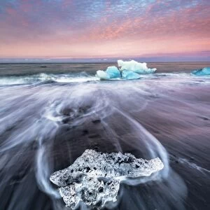 Jokulsarlon glacier lagoon, East Iceland. Blocks of ice on the black beach