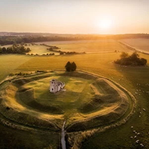 Knowlton Church and earthworks from the air at sunrise, Knowlton, Dorset, England, UK