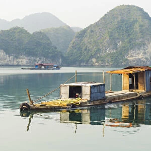 Lan ha bay, Halong arcipelago, Vietnam. Cargo floating boat