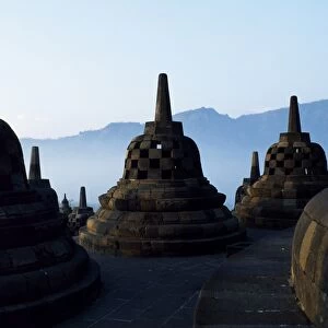 Latticed stupas on upper terraces, Borobodur temple, Java, Indonesia
