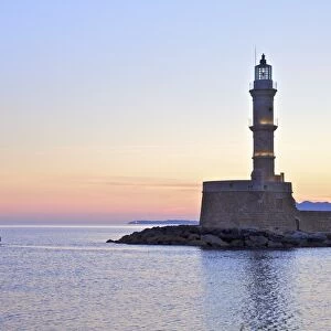 The Lighthouse and Fishing Boat in The Venetian Harbour at Sunrise, Chania, Crete