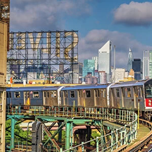 Line 7 subway train with the scenic Manhattan skyline in the background, Queens, New York, USA