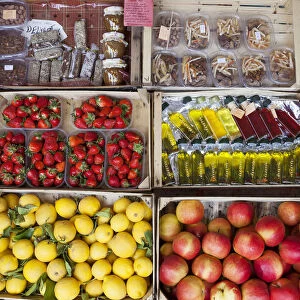 Local products, fruits and vegetables on sale in the market along the road near Komin