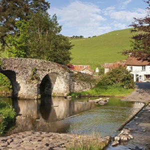 Lorna Doone Farm and stone bridge over the Badgworthy Water at Malmsmead, Exmoor