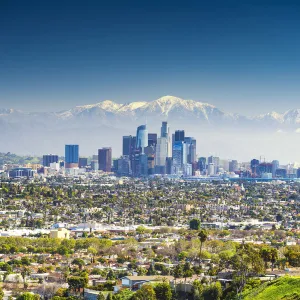 Los Angeles Skyline and Snow Capped San Gabriel Mountains, California, USA