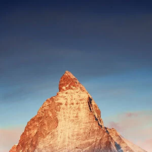 Majestic Matterhorn emerging from mist at sunrise, Gornergrat, Zermatt, Valais, Switzerland