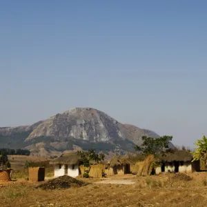 Malawi, Dedza. Grass-roofed houses in a rural village in the Dedza region