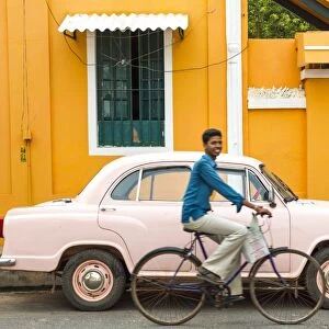 Male cyclist and Ambassador car, Pondicherry (Puducherry), Tamil Nadu, India