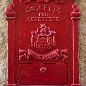 Malta, Europe; A coloured letter box, normally found in village or town cores complimenting colourful doors