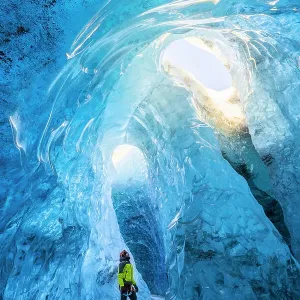 Man in an ice cave of Breidamerkurjokull, Austurland, Iceland(MR) Man in an ice cave of Breidamerkurjokull, Austurland, Iceland(MR)