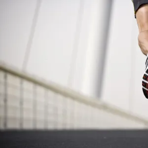 A man running across a bridge