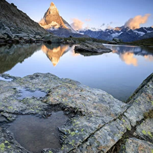 Matterhorn reflected in Lake Stellisee at dawn Zermatt Pennine Alps Canton of Valais
