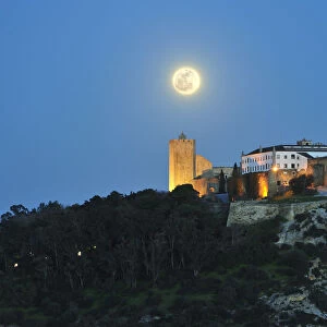 The medieval castle of Palmela in a full moon night. Portugal