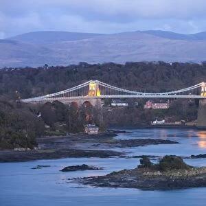 The Menai Bridge spanning the Menai Strait, backed by the mountains of Snowdonia National Park