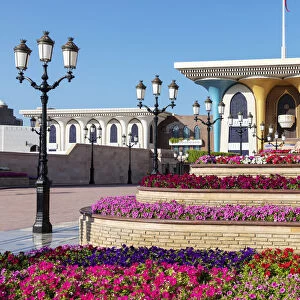Middle East, Oman, Muscat. Rows of colourful flowers planted in front of Al Alam